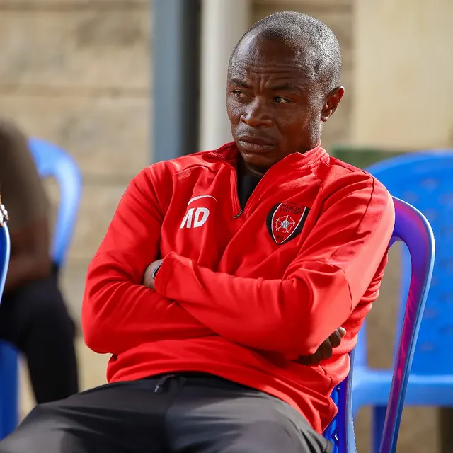 Coach MD in the team tracksuit