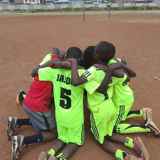 Santos Soka Academy — Team huddle in the lime green kit