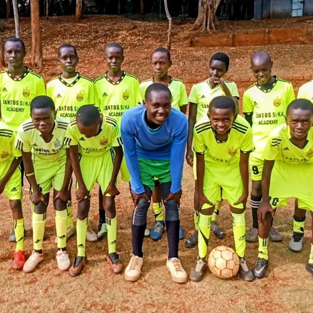 Santos Soka Academy — Lime green youth squad lined up with their coach