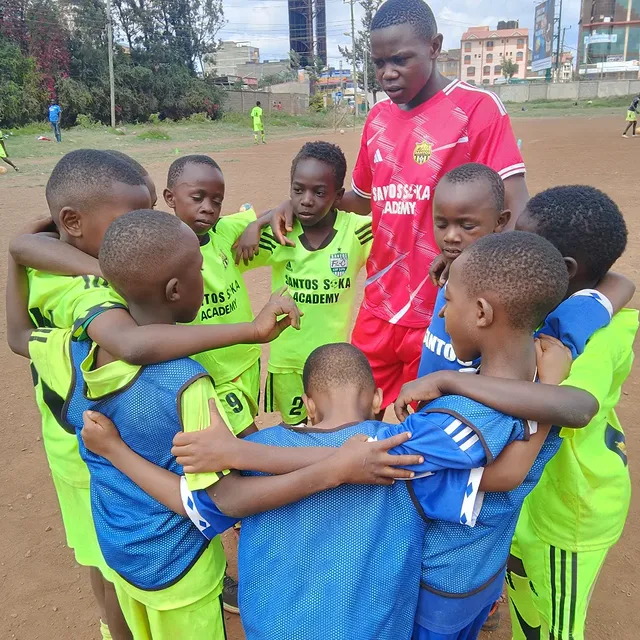 Santos Soka Academy — Lime-kit youth squad celebrates