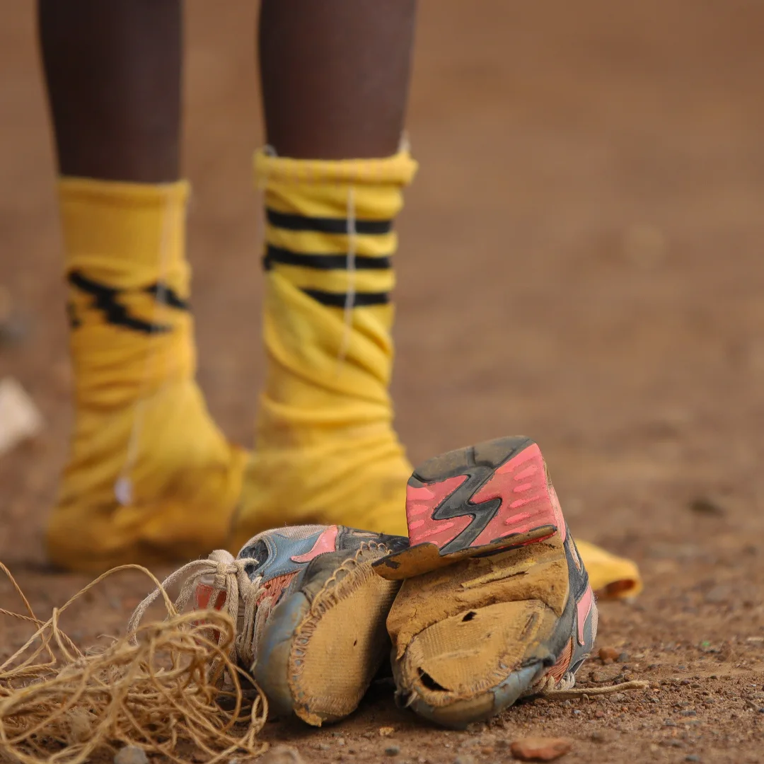 Santos Soka Academy — Boots and yellow socks on the training pitch