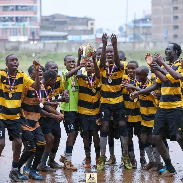 Santos Soka Academy — Celebrating as the trophy is lifted